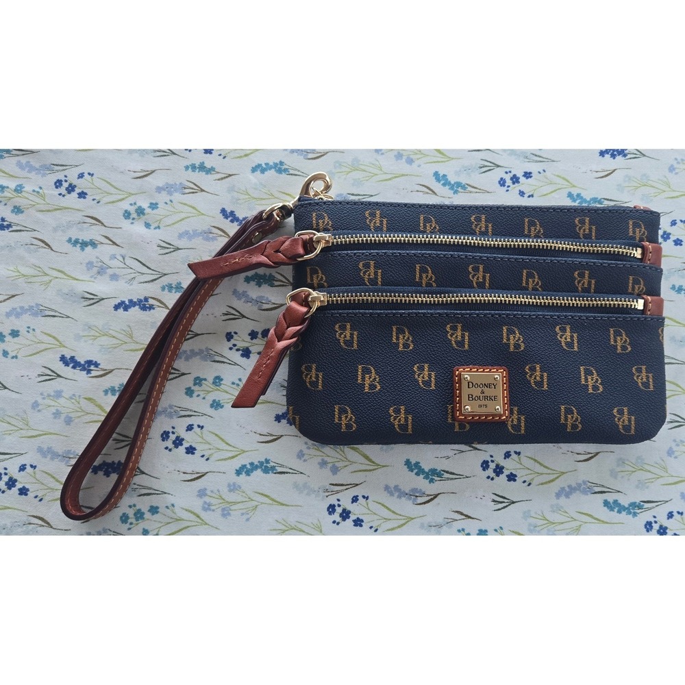 Dooney & Bourke Gretta Triple Zip Wristlet Navy Blue Monogram Coated Canvas Bag